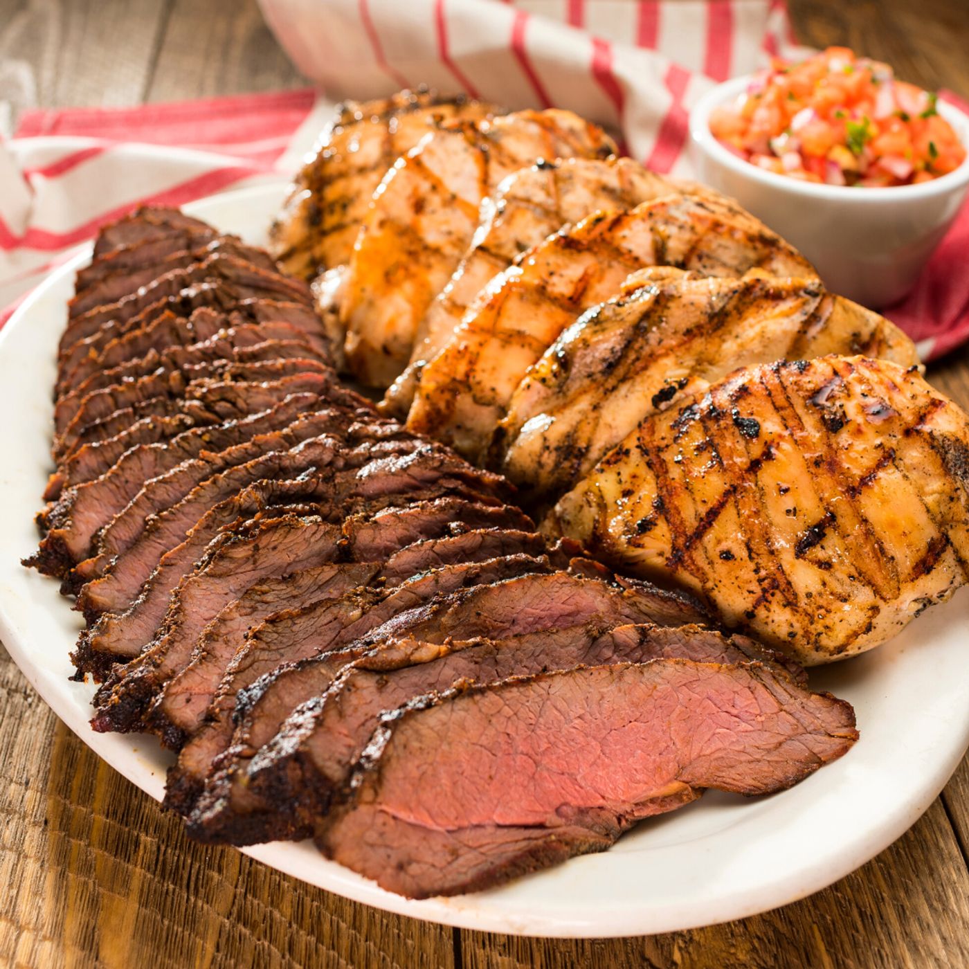 photo of sliced steak and grilled chicken combo